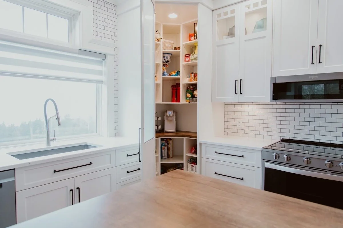 Custom cabinetry and pantry storage drawers built for a kitchen remodel in Durham Region.