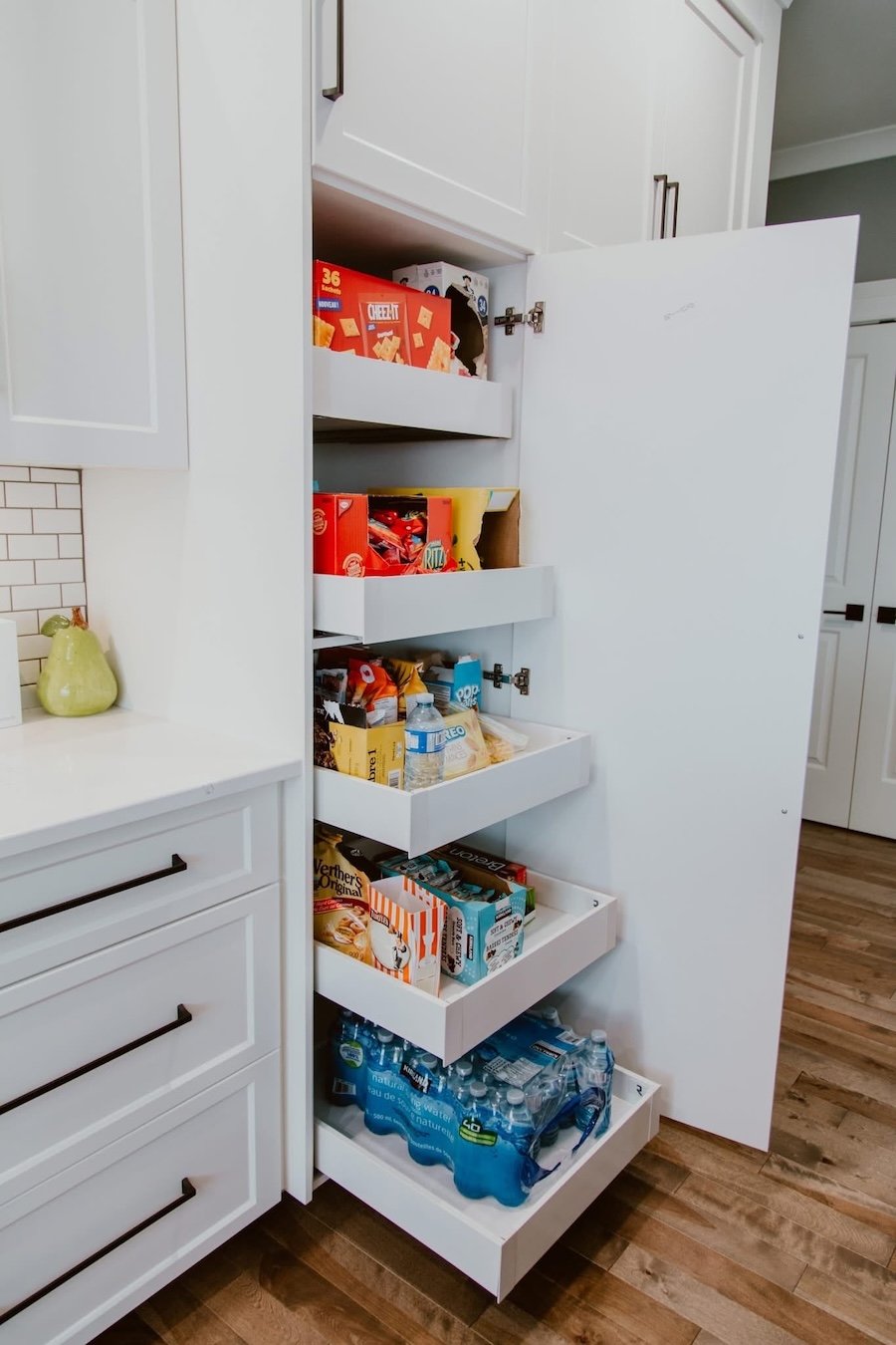 Custom kitchen pantry cabinetry with pull-out storage drawers installed during a kitchen renovation in Durham Region.