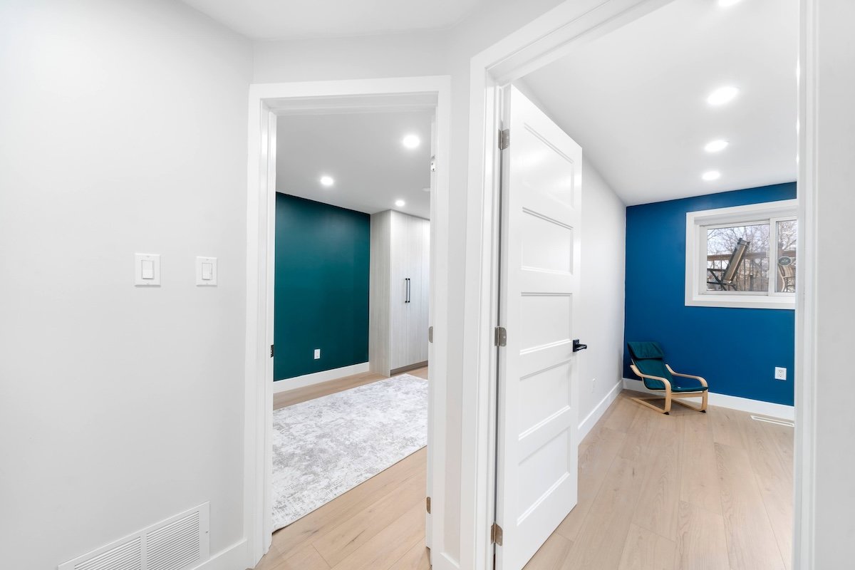 Finished basement hallway with clean trim and recessed lighting in Oshawa backsplit renovation