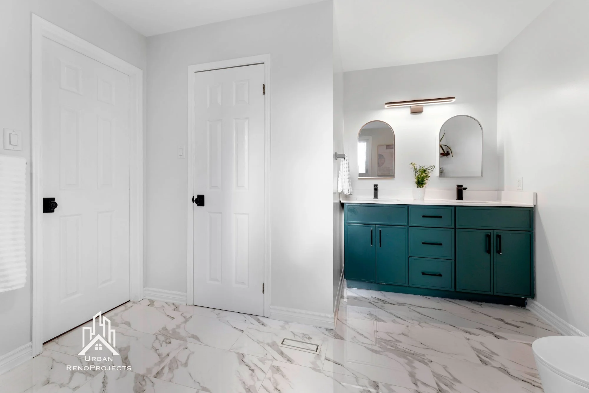 Close-up of gold faucet on freestanding bathtub in luxury ensuite