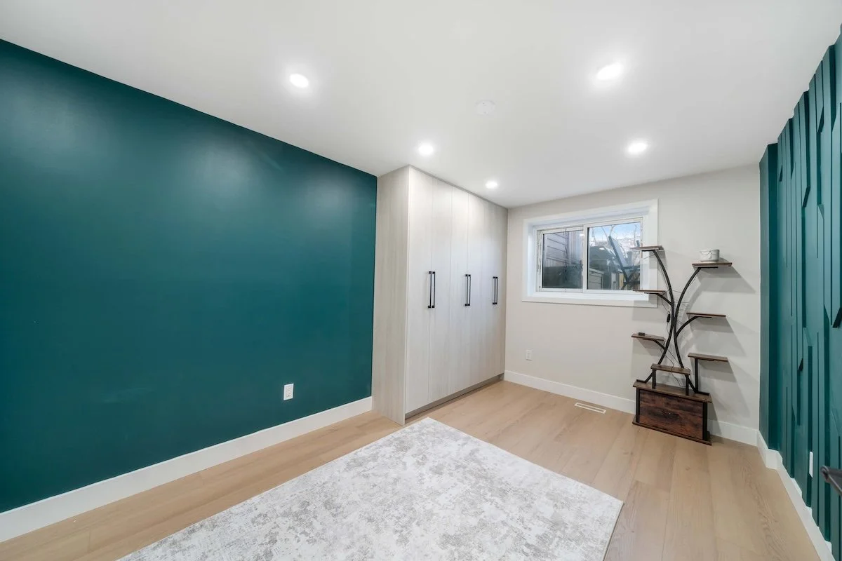 Modern basement office space with custom cabinetry and lighting Oshawa