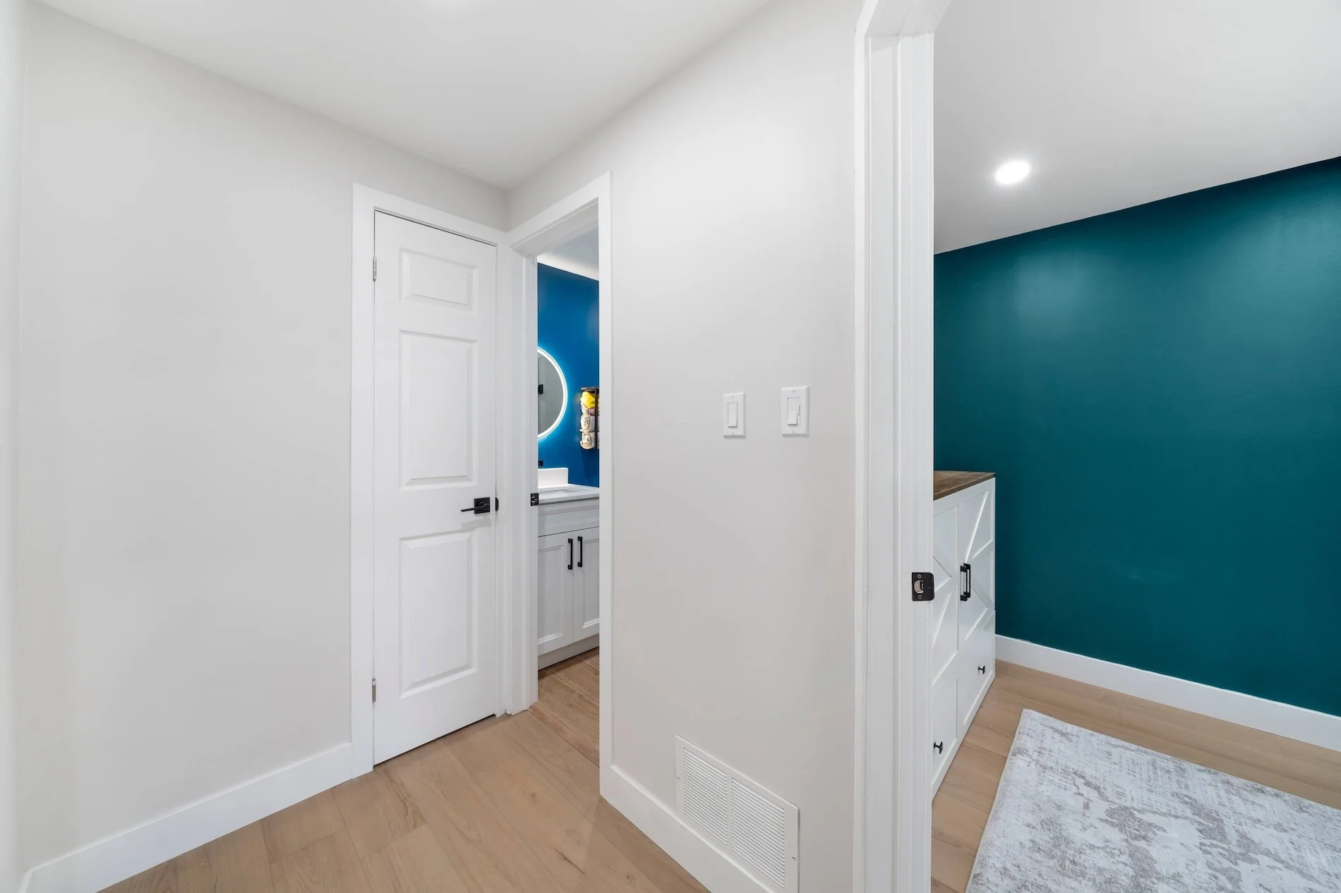 Basement hallway leading to bedroom in modern Oshawa backsplit renovation