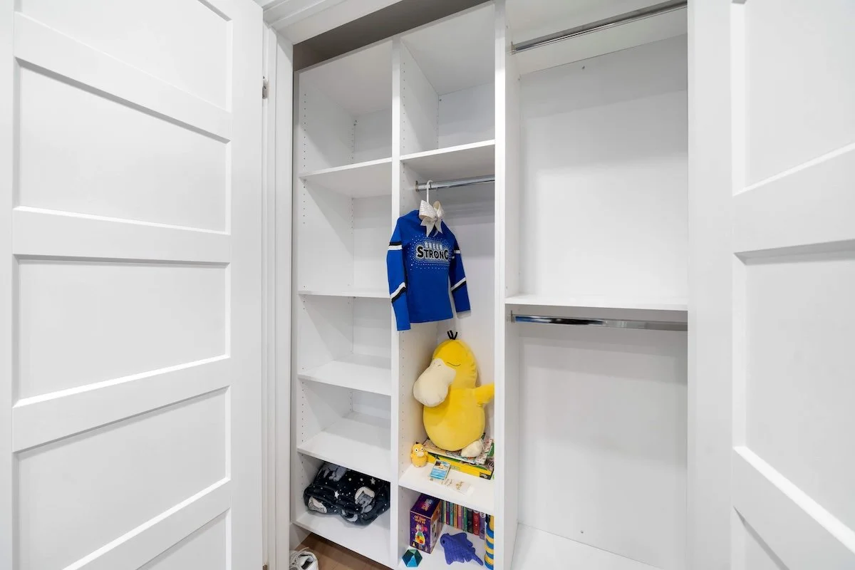 Custom built-in wardrobe in basement bedroom with modern storage design Oshawa