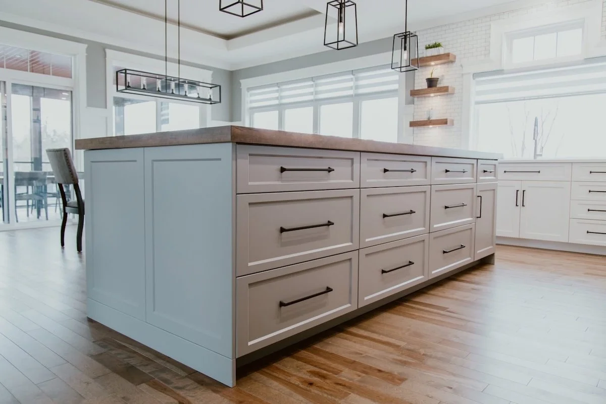 Custom kitchen island with quartz countertop installed during a Durham Region kitchen renovation.