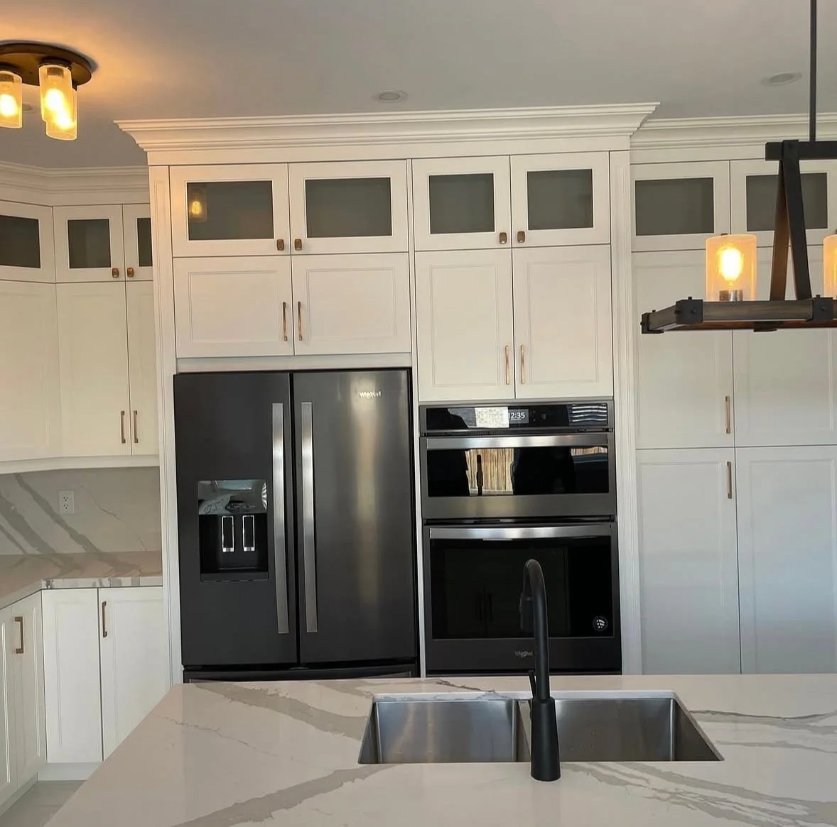 Custom kitchen remodel in Port Whitby featuring modern cabinetry, a large island, and updated finishes
