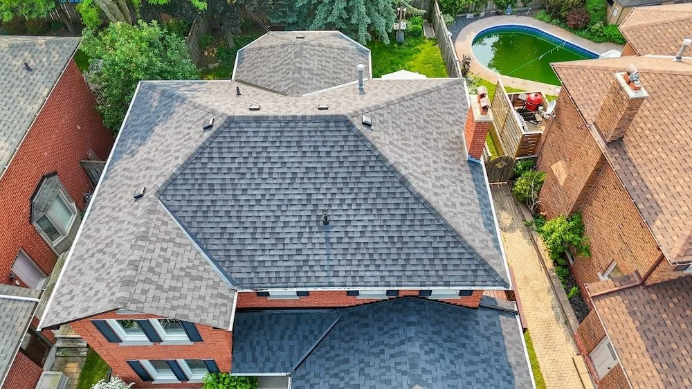 Ajax roofing contractor installing 25 lb base sheet eaves protection at roof edge