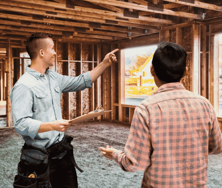 contractor talking to client on-site about remodel progress work