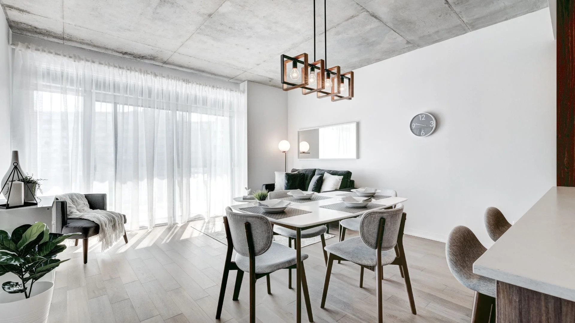 Modern Oshawa condo renovation with open-concept kitchen, quartz island seating, and custom wood cabinetry