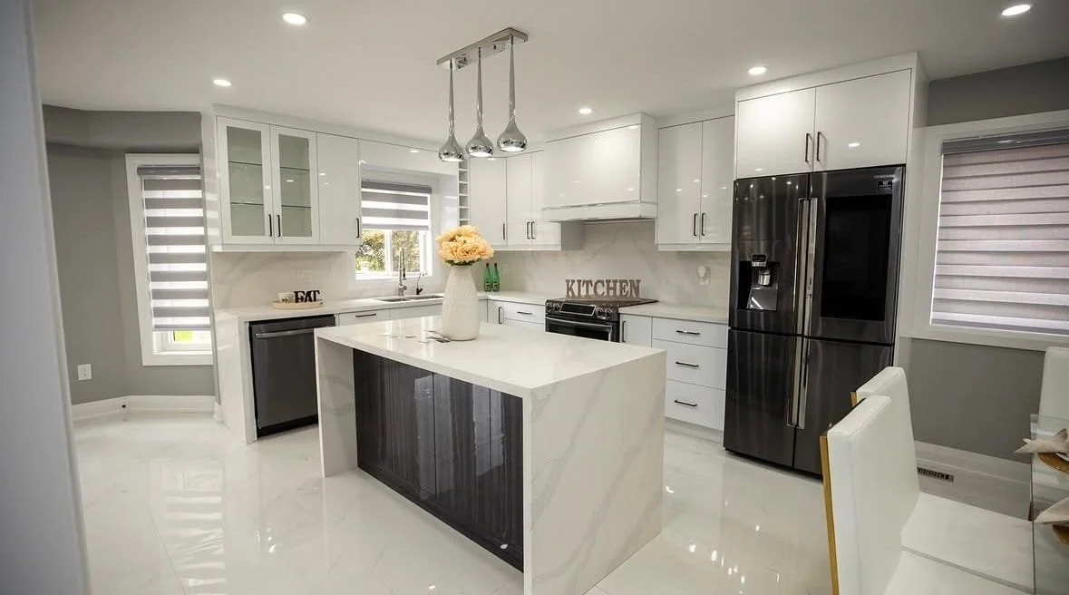White kitchen renovation in Pringle Creek, Whitby, featuring bright cabinetry, quartz countertops, and a modern island