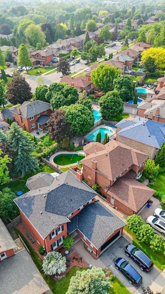Black aluminum fascia drone shot on re‑roofed home in Ajax