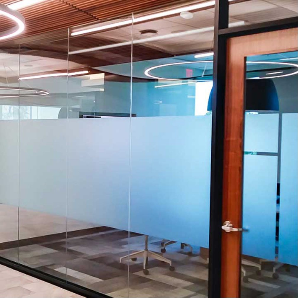 Images shows partial frosted vinyl on an indoor window for an office