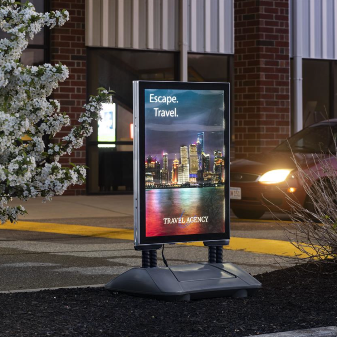 Image of an illuminated flex sign in a driveway