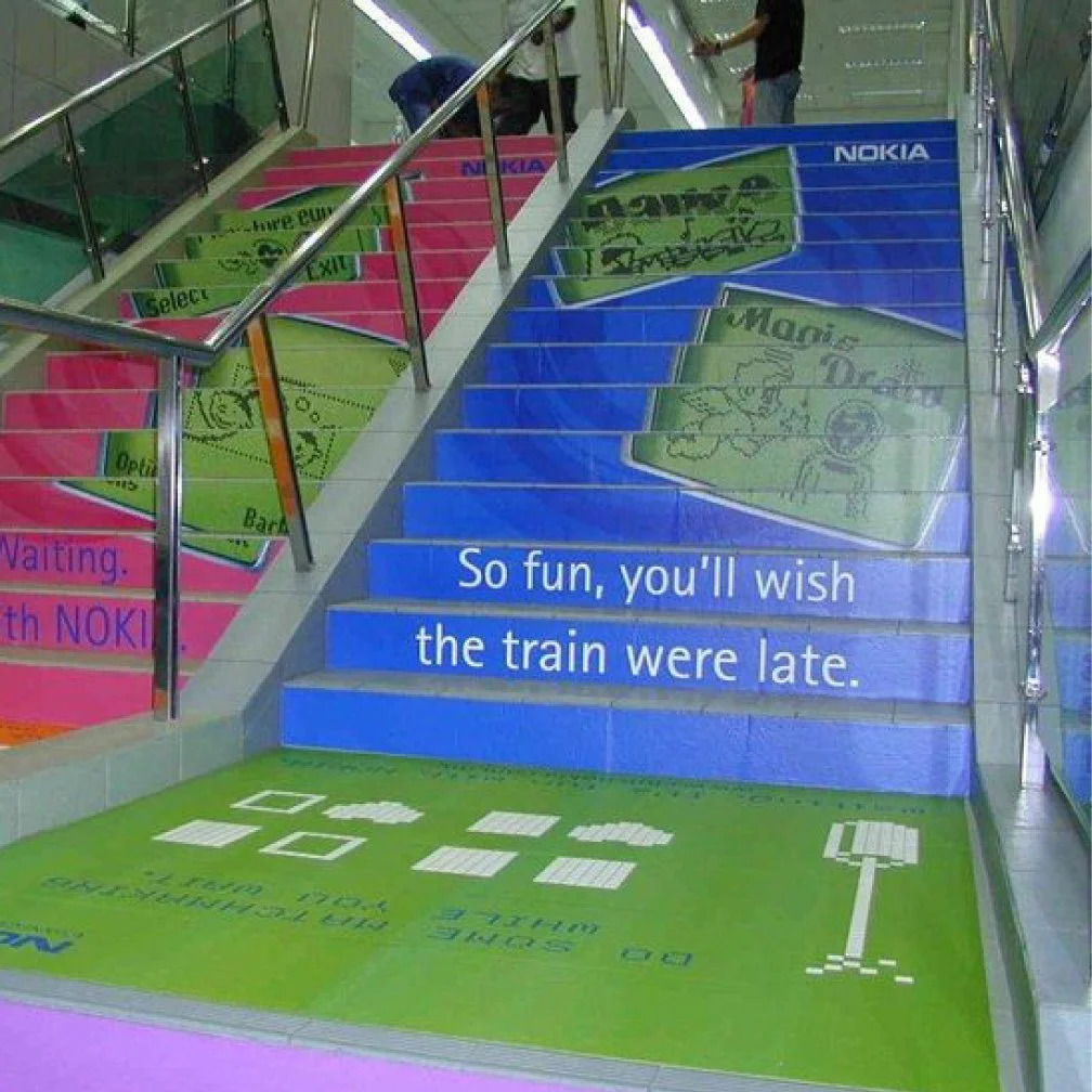 image of colorful printed floor graphics applied to stairs and floor