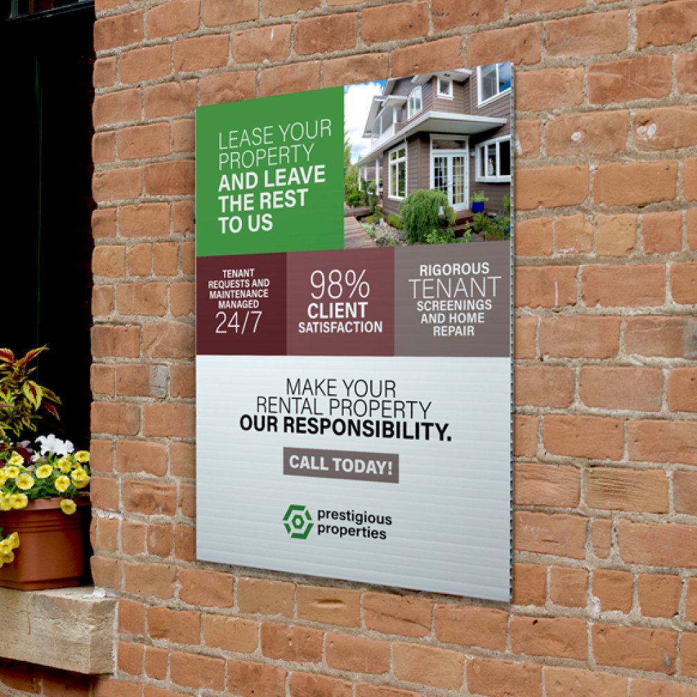 Printed sign applied on corrugated plastic hanging on a brick wall