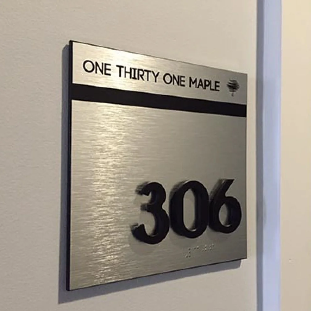 image of a room sign with raised 3D letters