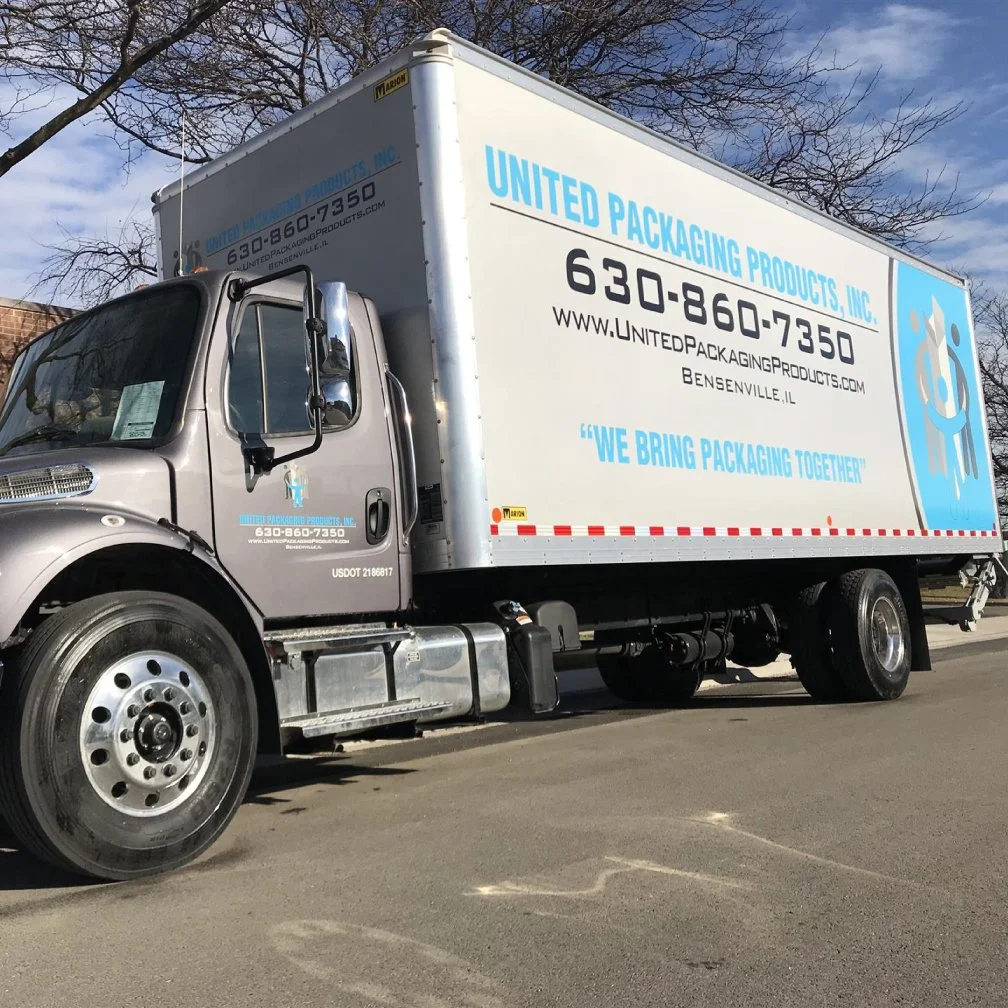 image shows commercial truck wrapped in custom printed vinyl