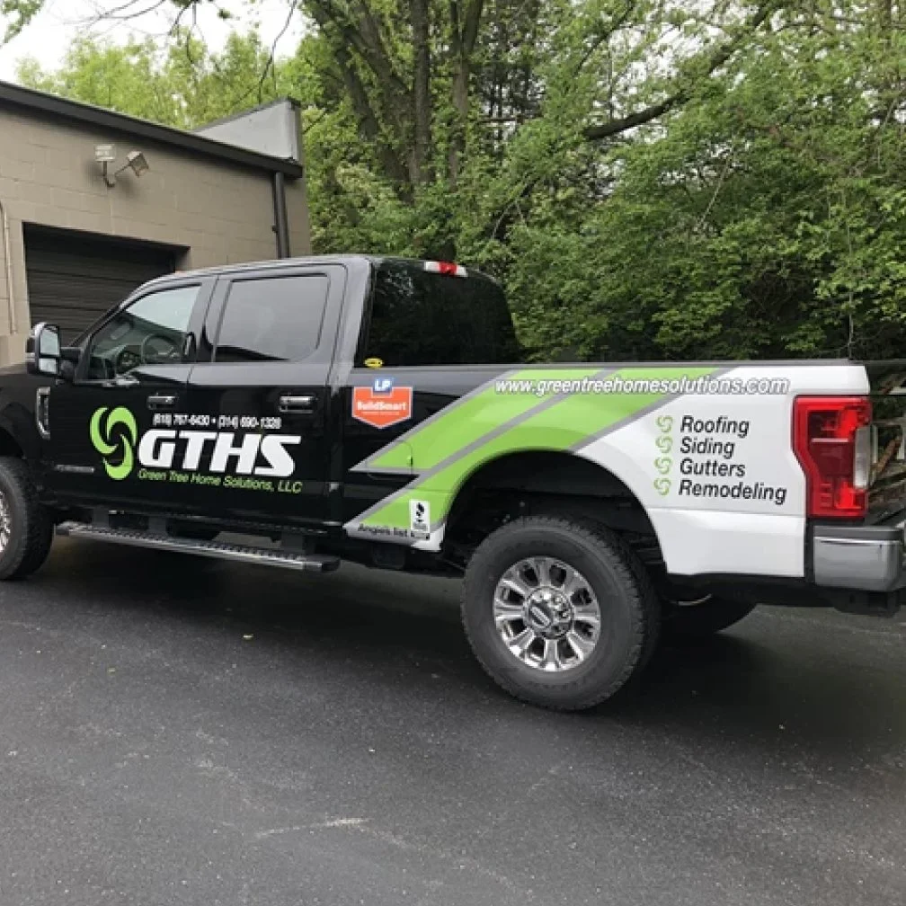 image shows a printed vehicle wrap on a pick up truck