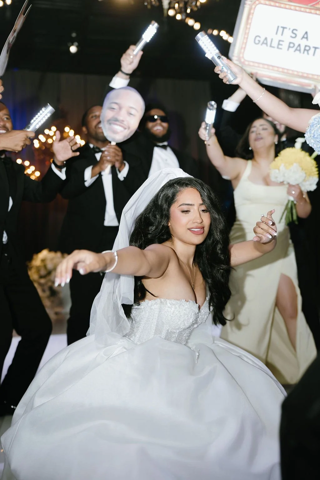 Bride and groom celebrating with family and friends at a Latino wedding reception in Chicago