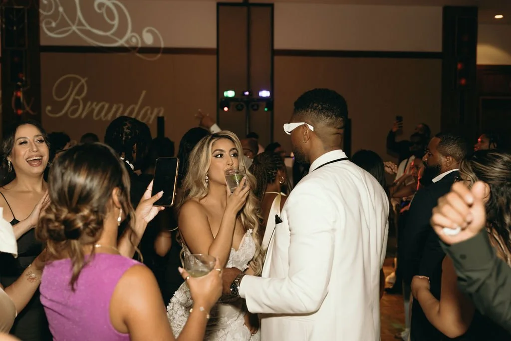 Bride, groom and guests celebrating on the dance floor at a Chicago wedding reception