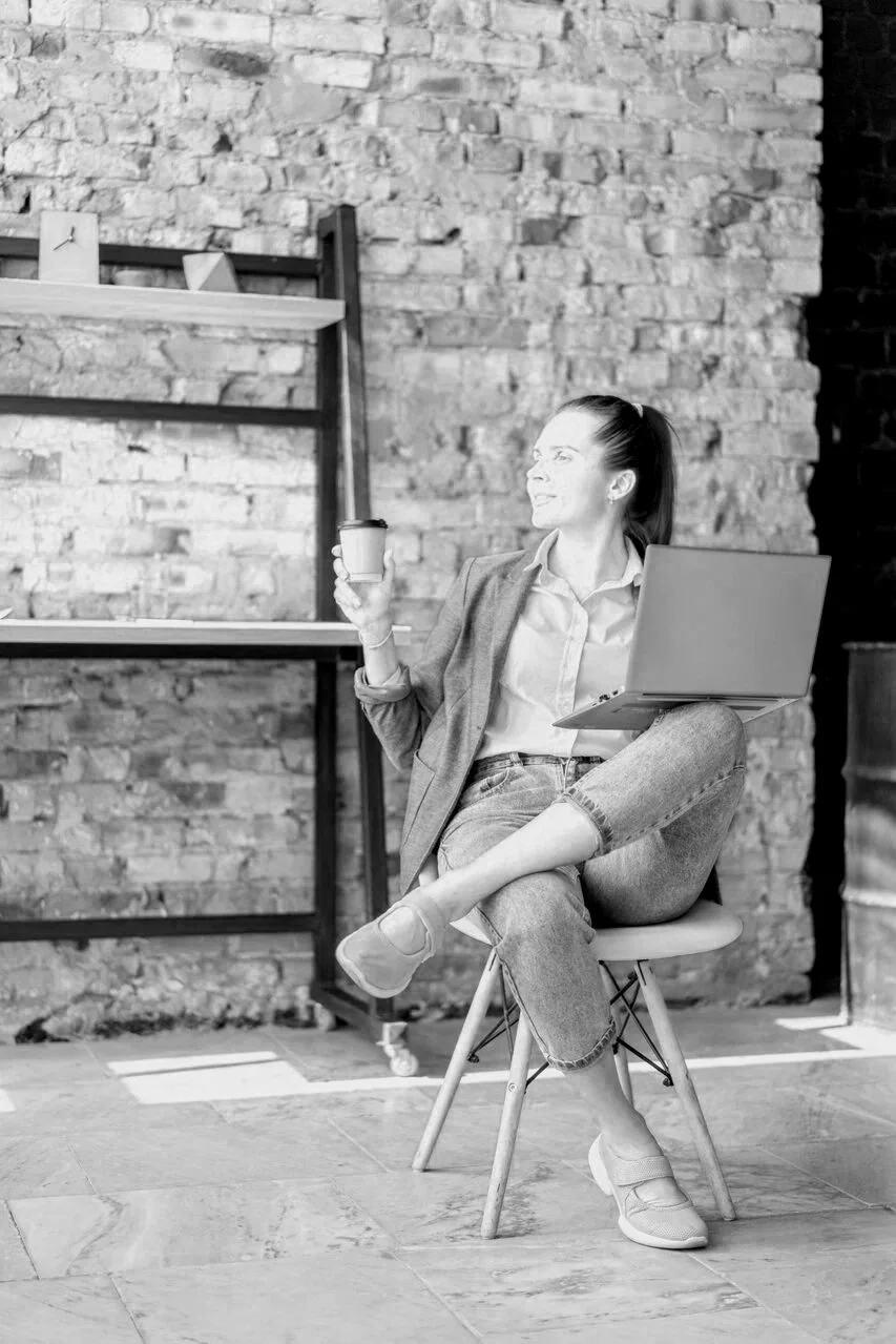 woman sitting ith laptop-mariachristie-hypnotherapy-career-money-blocks