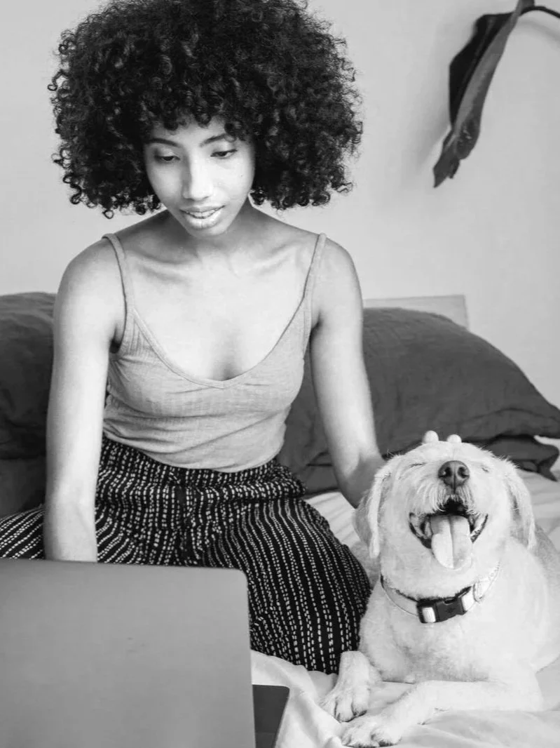 woman-relaxing-with-laptop-and-her-dog