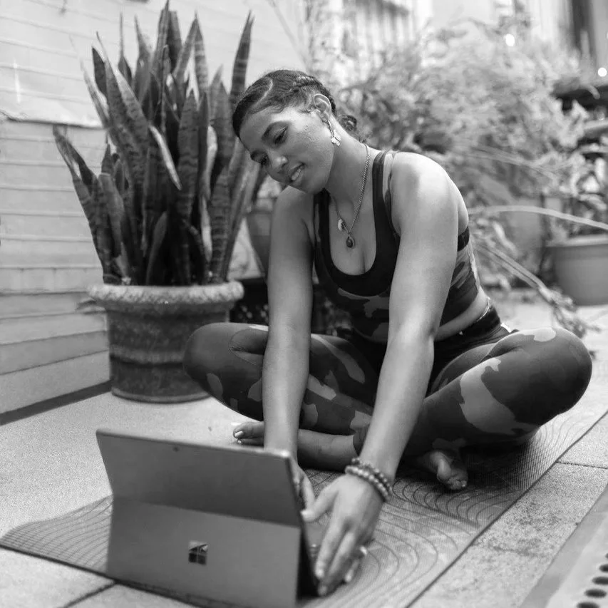 womandoingonlineyogaclass