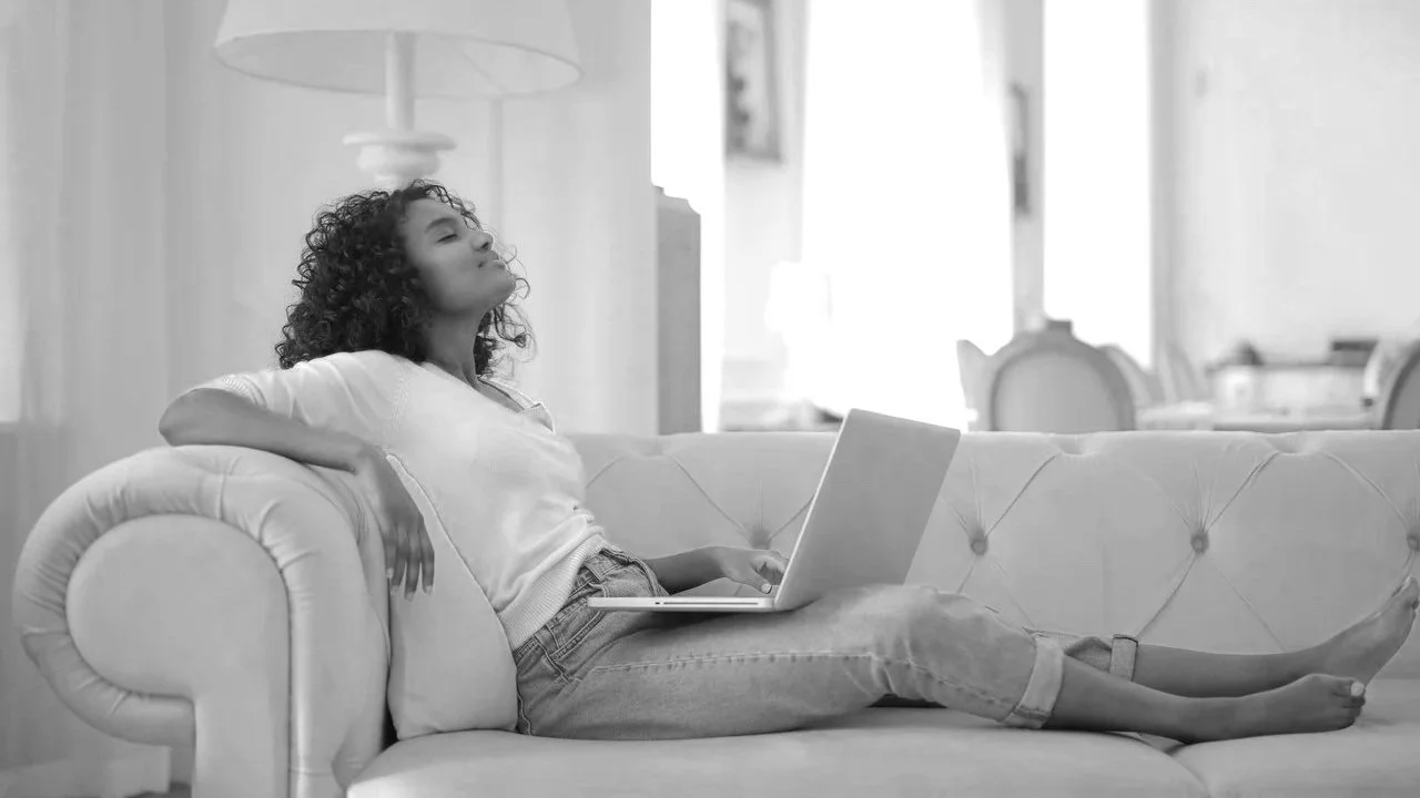 woman relaxing with her eyes closed on her sofa-mariachristiehypnotherapy
