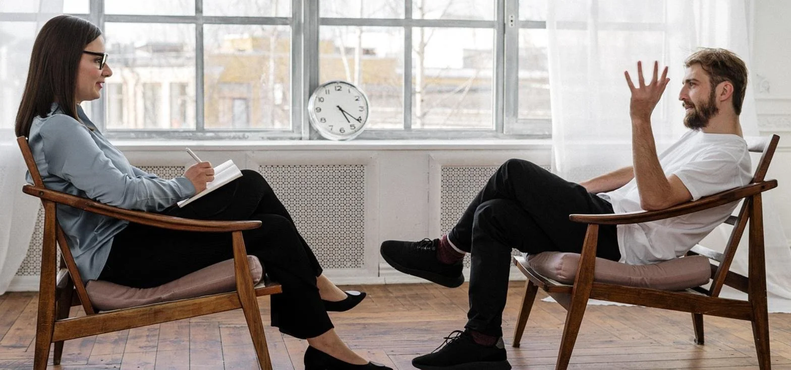 Individual in a solo therapy session, building toward intensive couples therapy