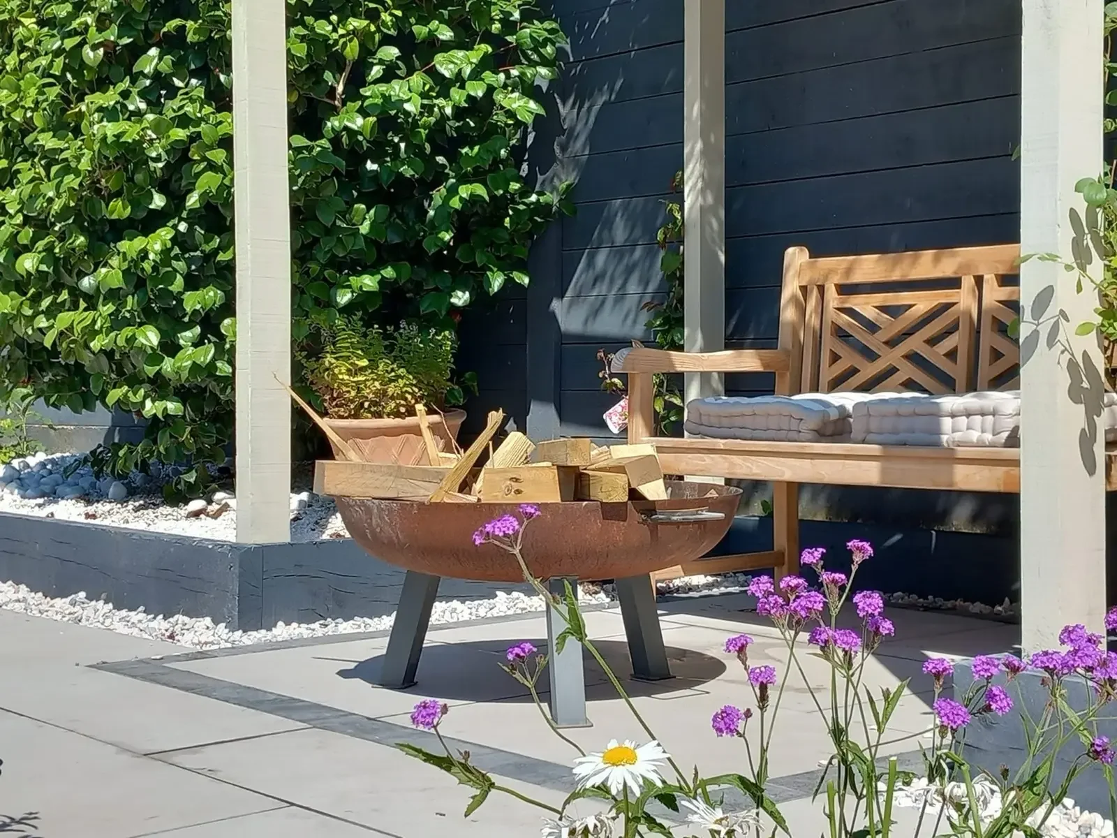 Garden focal point with porcelain paving and garden arbour near Nantwich 