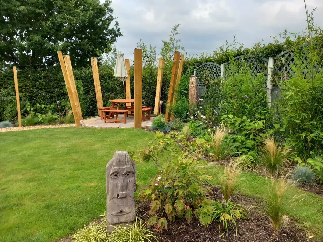 After hard and soft landscaping showing plants thriving and a skilfully constructed patio with outdoor lighting in Haslington. Crewe