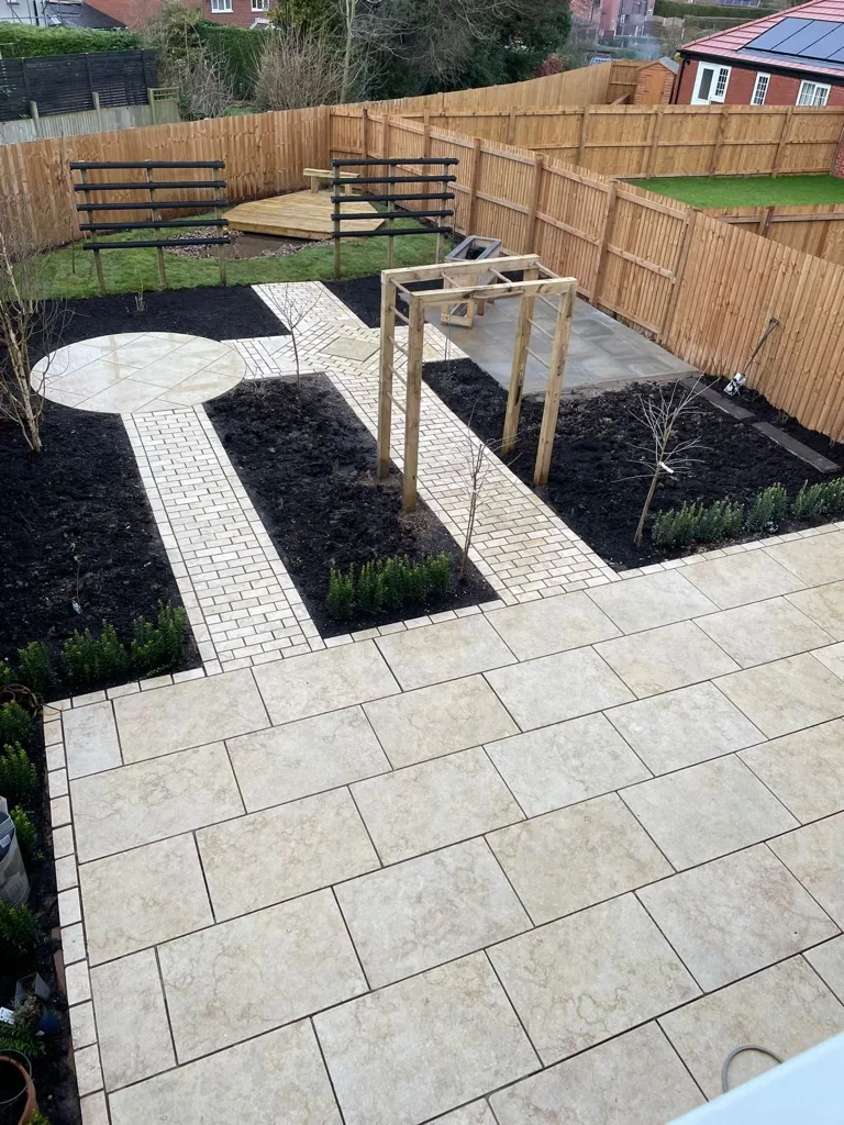 Egyptian limestone paving installed with pathways and bespoke features during new build garden landscaping in Shavington