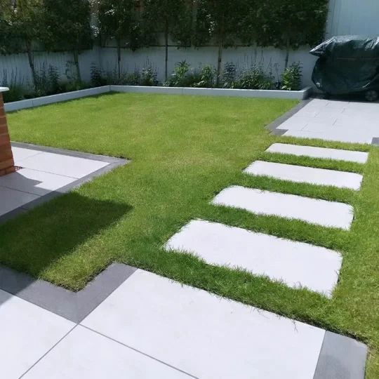 Porcelain paving with stepping stones across lawn replacement for a new build garden transformation in Moston between Middlewich and Sandbach