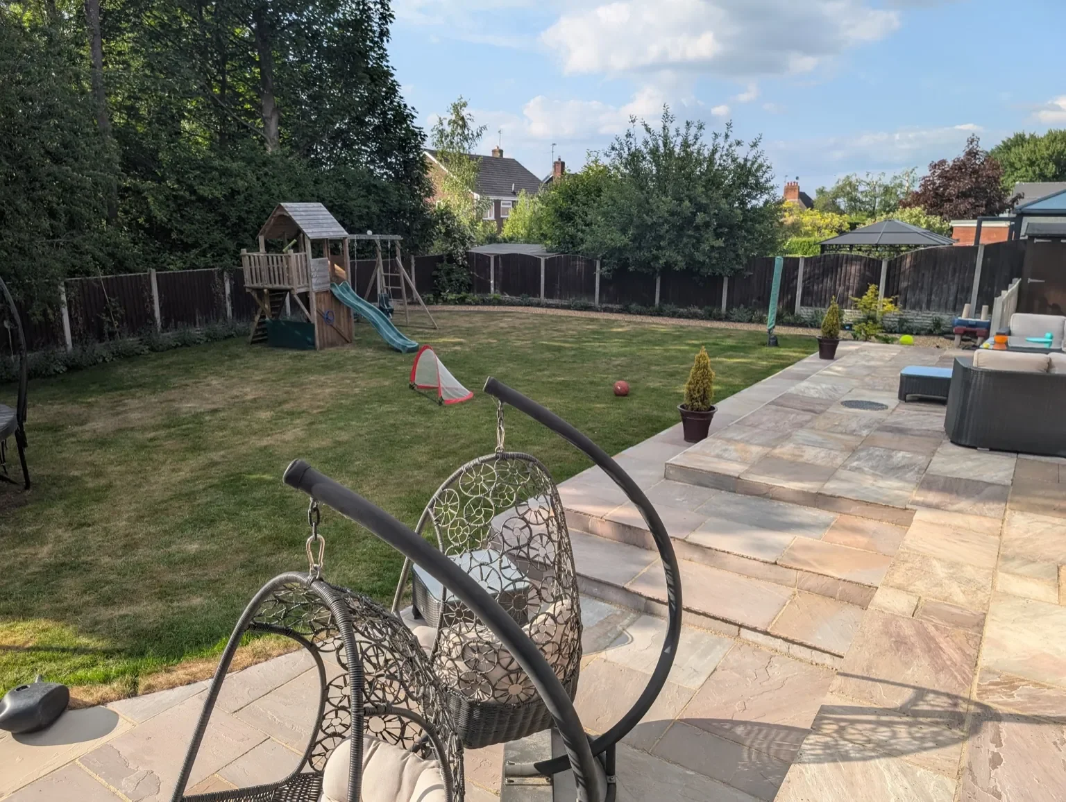 After full garden landscaping with Indian sandstone paving in Alsager