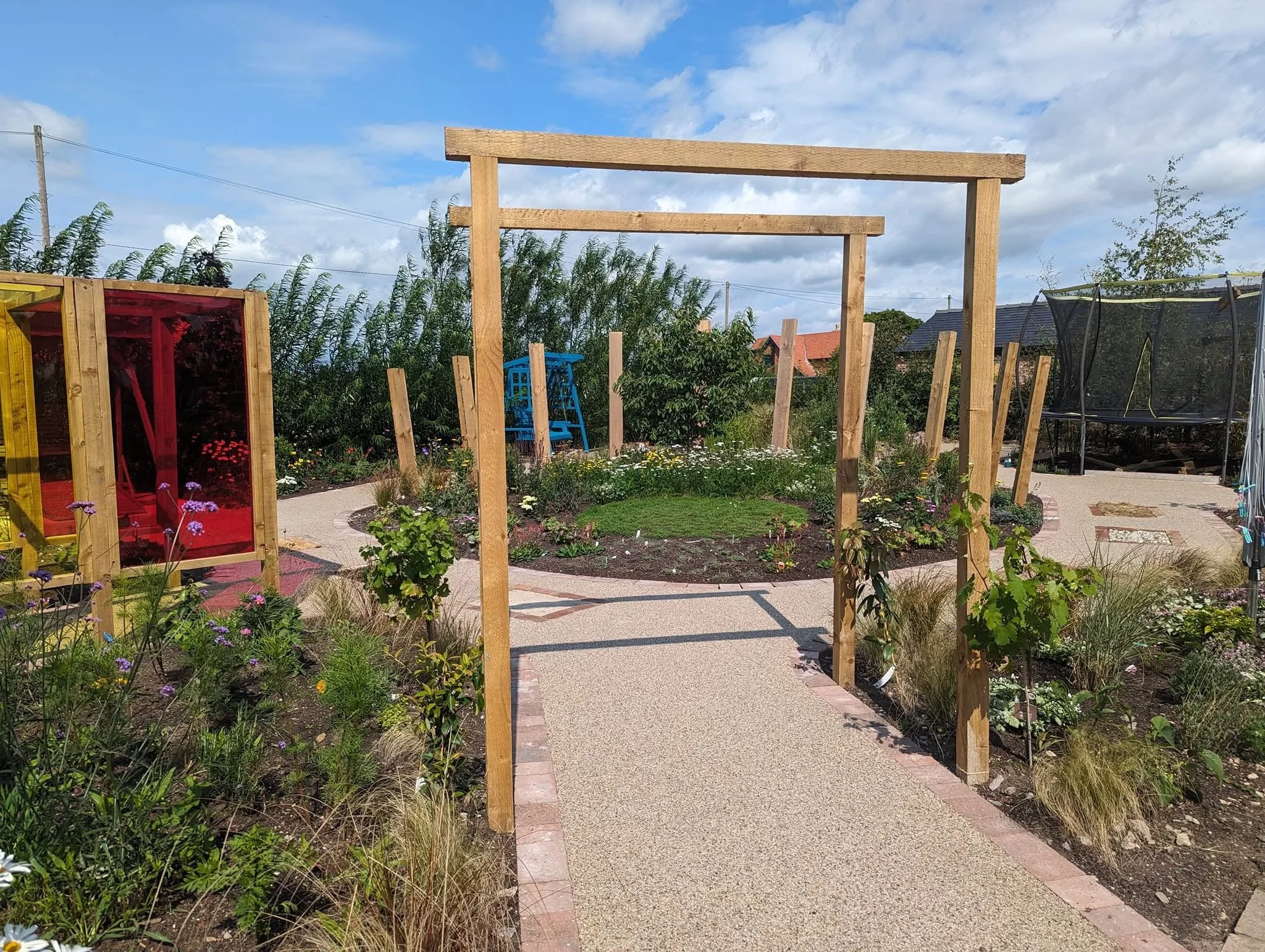 Children’s sensory garden design and installation near Nantwich with resin bound pathways