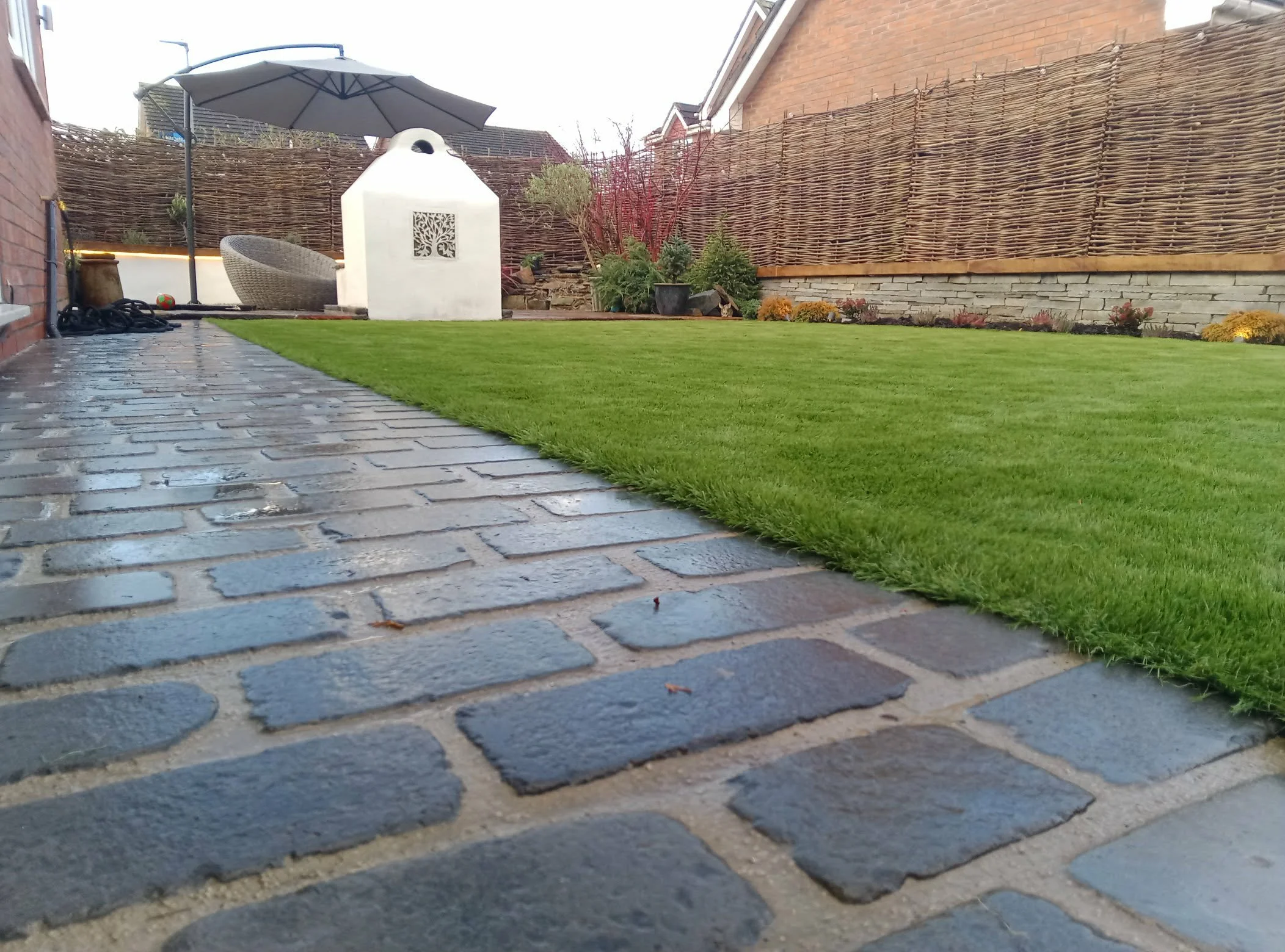 Granite setts installed as a pathway within this full garden makeover in Crewe.