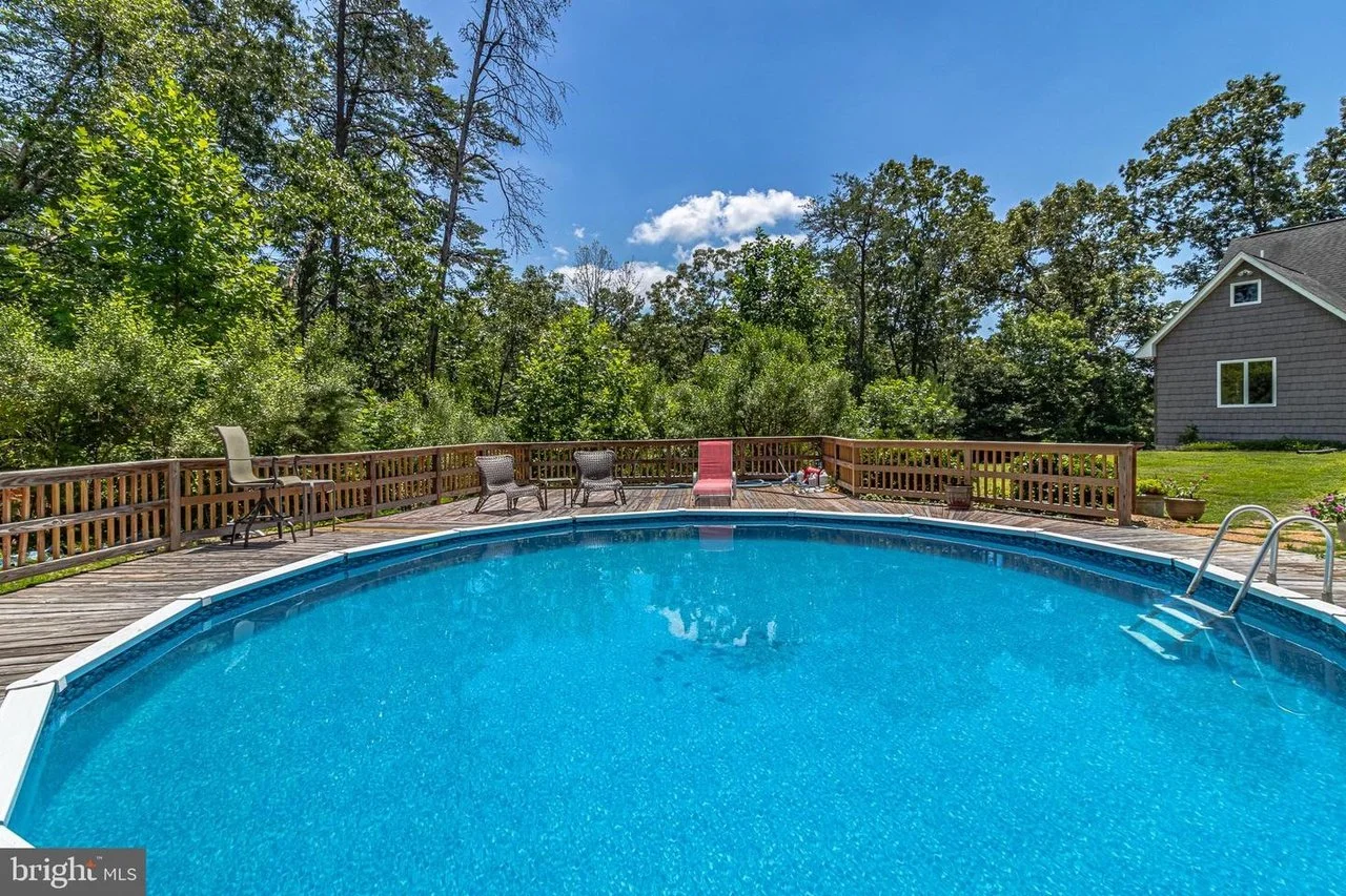 Outdoor pool with waterfront grounds