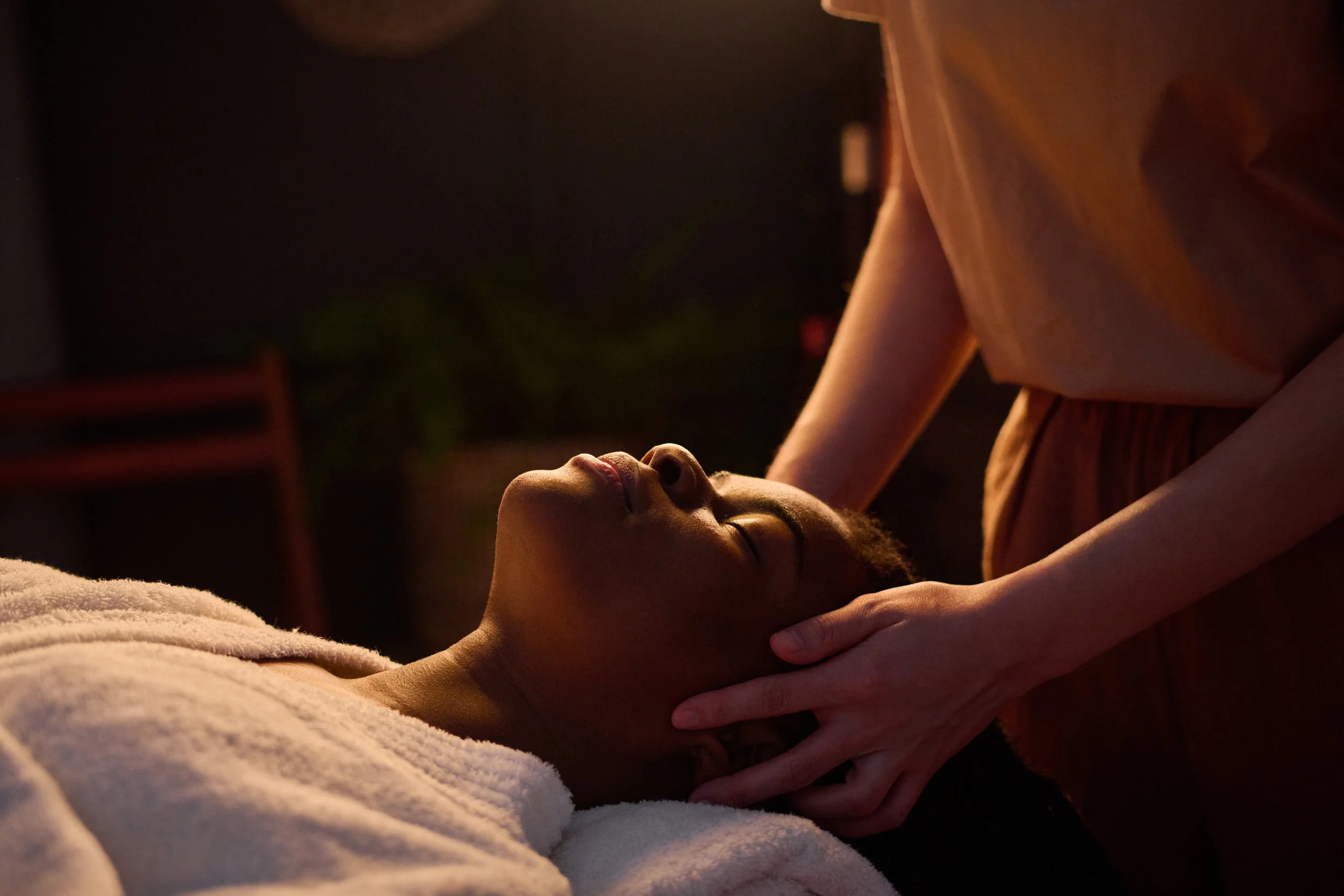 african-american-woman-getting-head-massage-at-spa-2025-03-03-14-24-17-utc.jpg