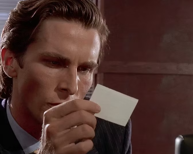 patrick-bateman-looking-at-paul-allen-s-businesscard-in-american-psycho.png