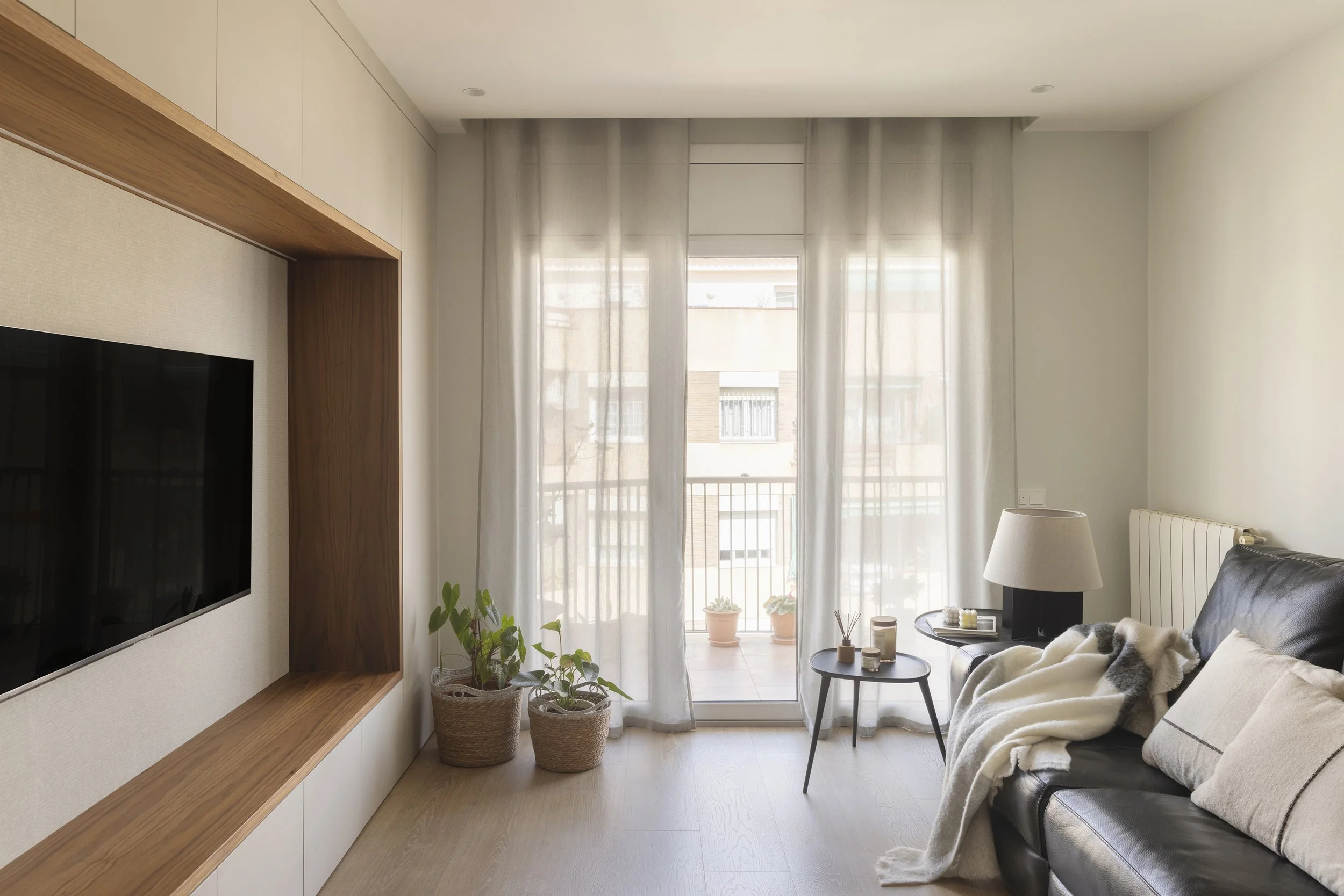 Living room area designed by Alba Roca Studio for the Castillejos project in Barcelona, framed with custom joinery and Medi.jpg