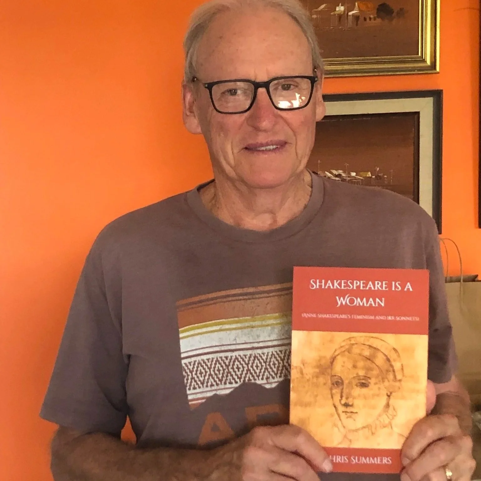 Chris Summers holding book Shakespeare is a Woman