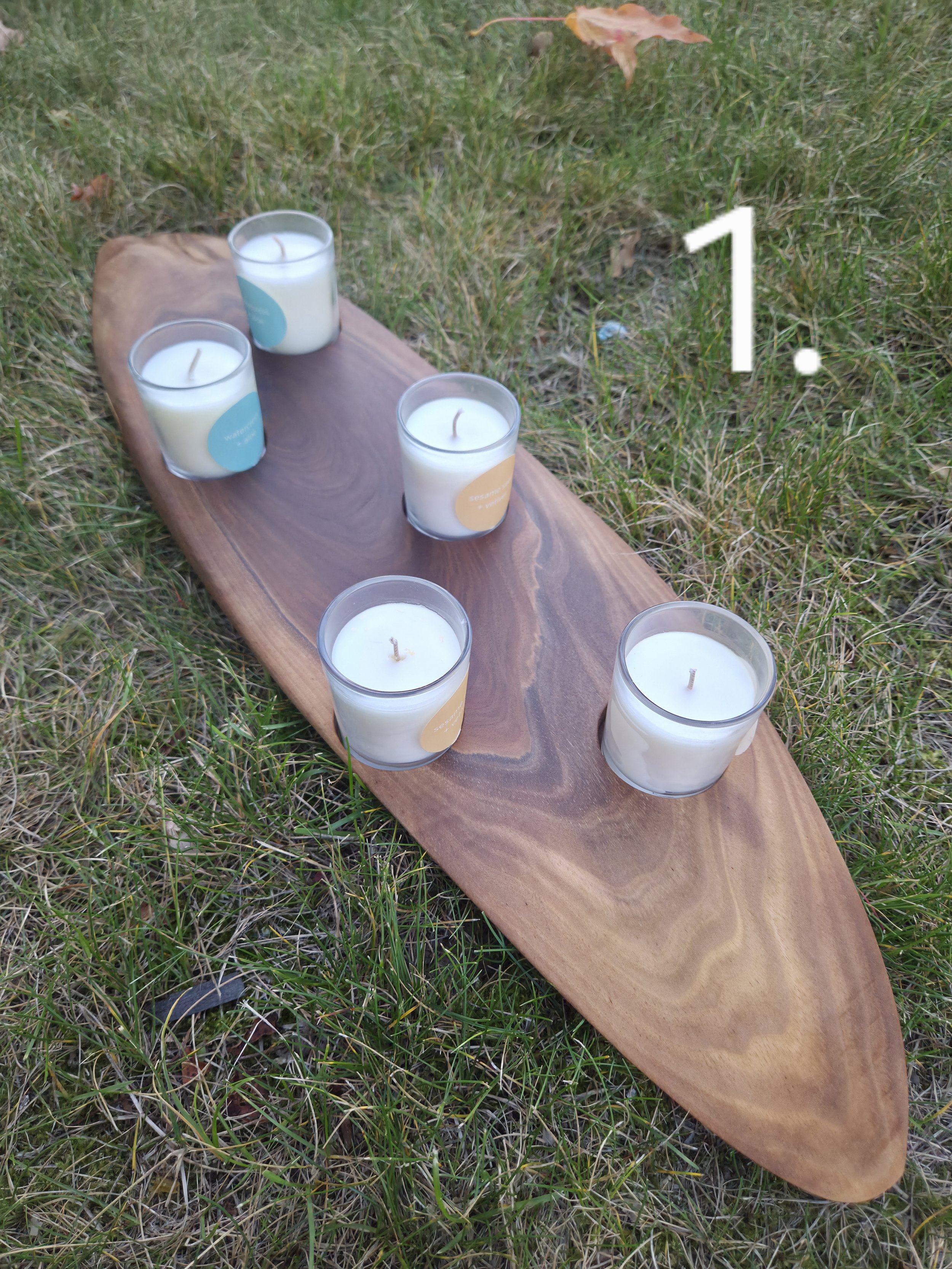 candle holder made from end grain board lying on the grass
