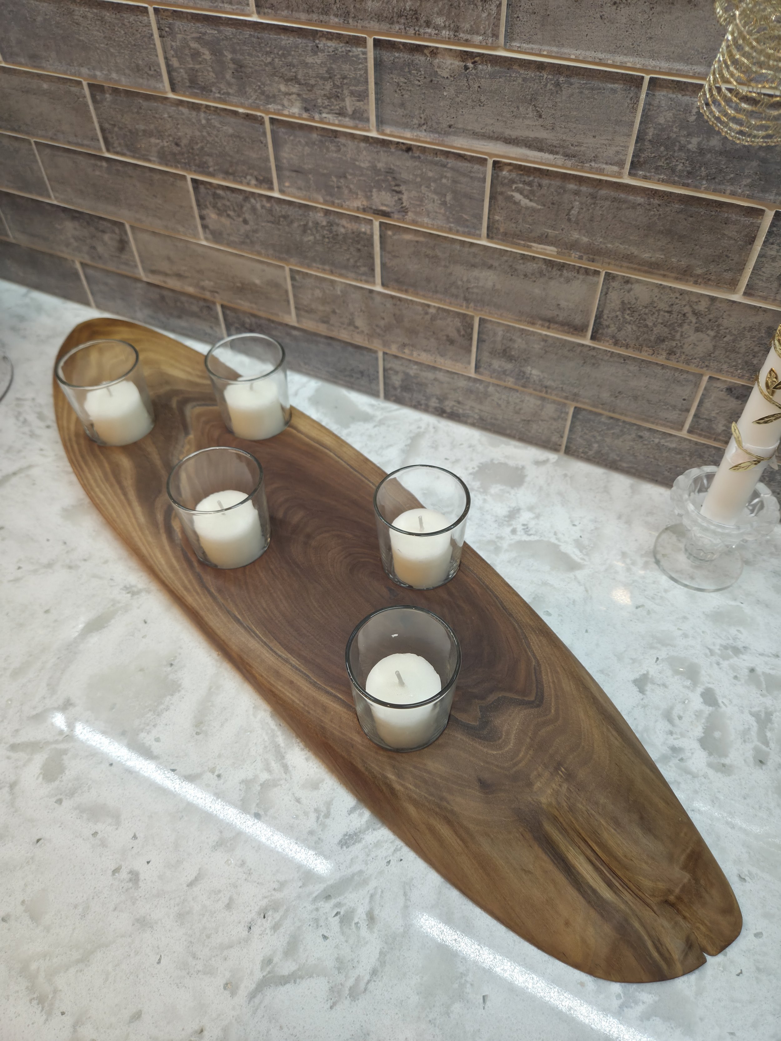 wooden candle holder sitting on counter
