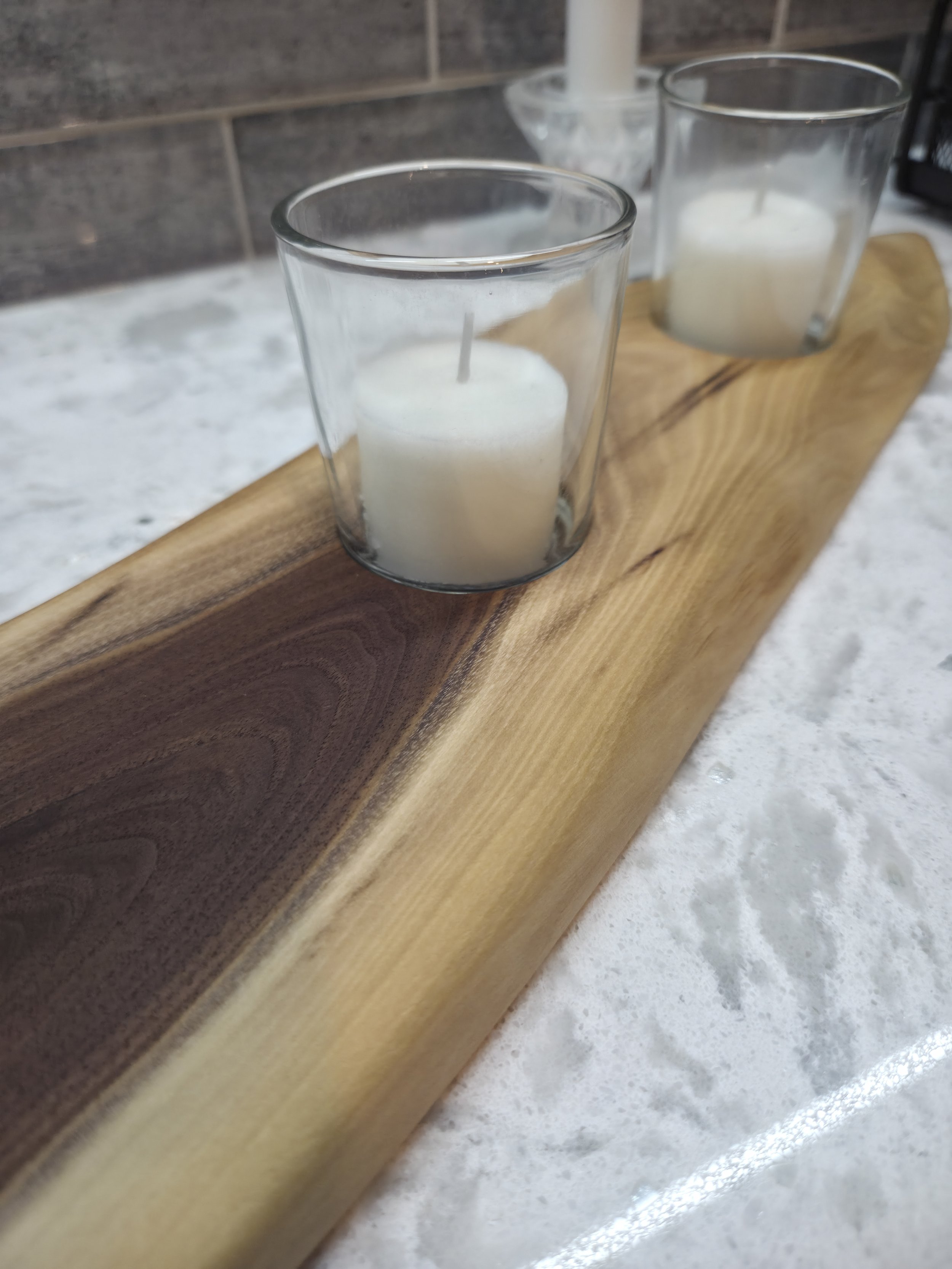 wooden candle holder sitting on counter
