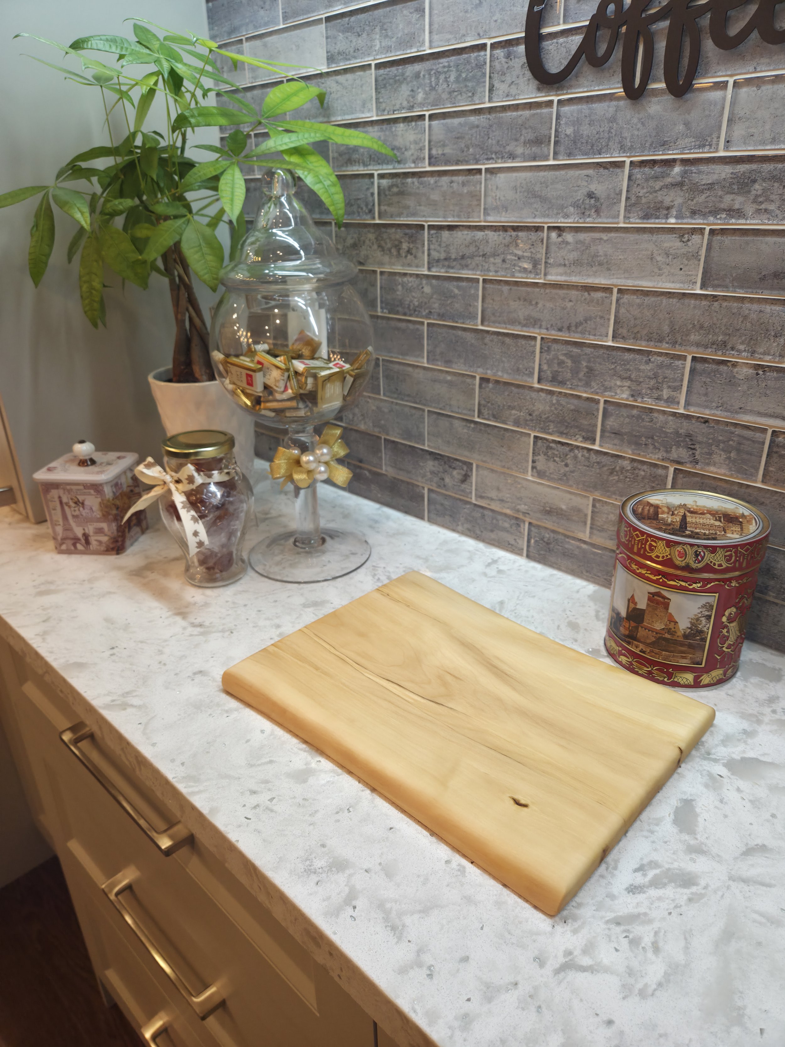 maple live edge cutting board on a counter