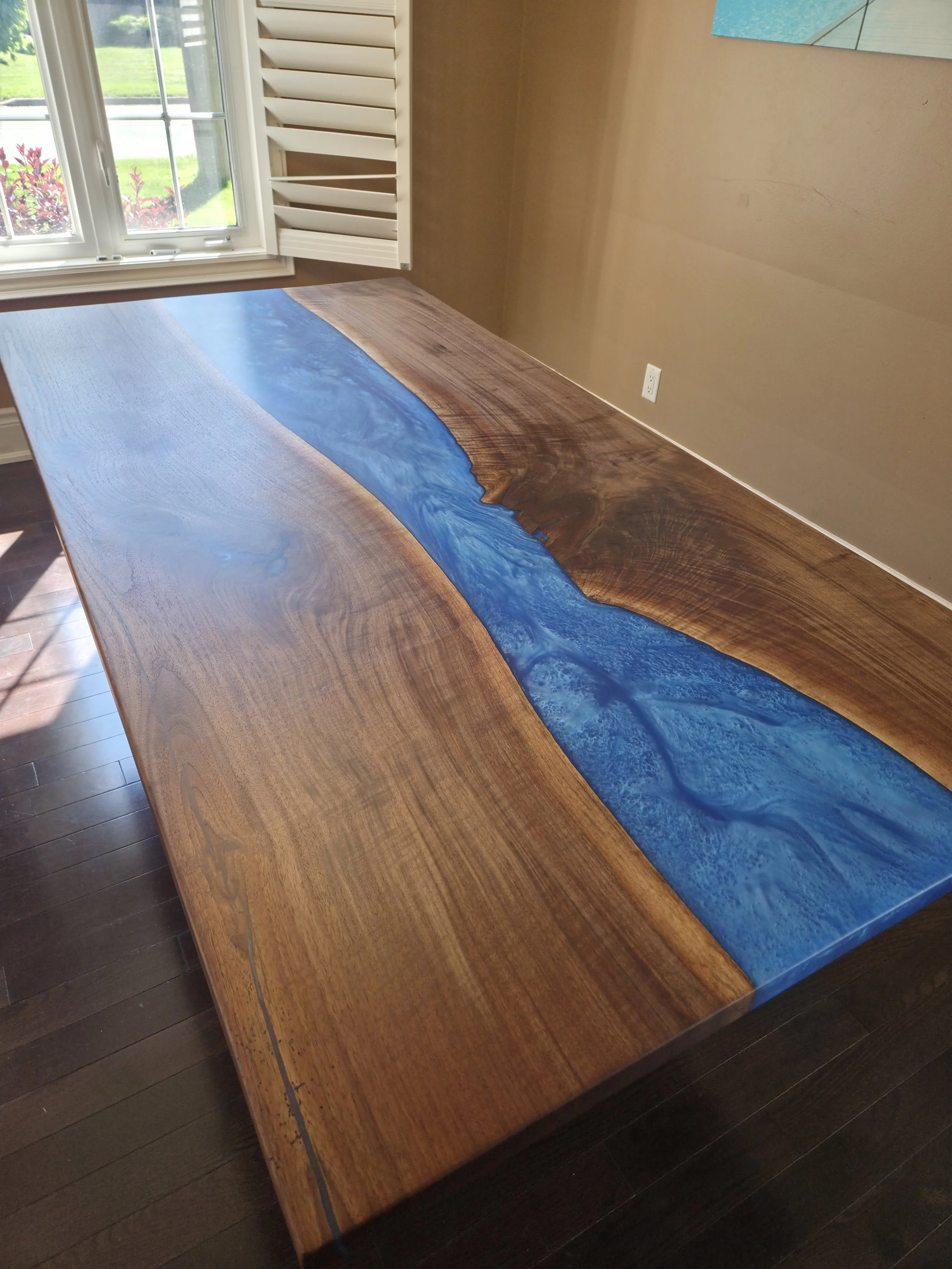Blue ocean epoxy table in a living room or clients home