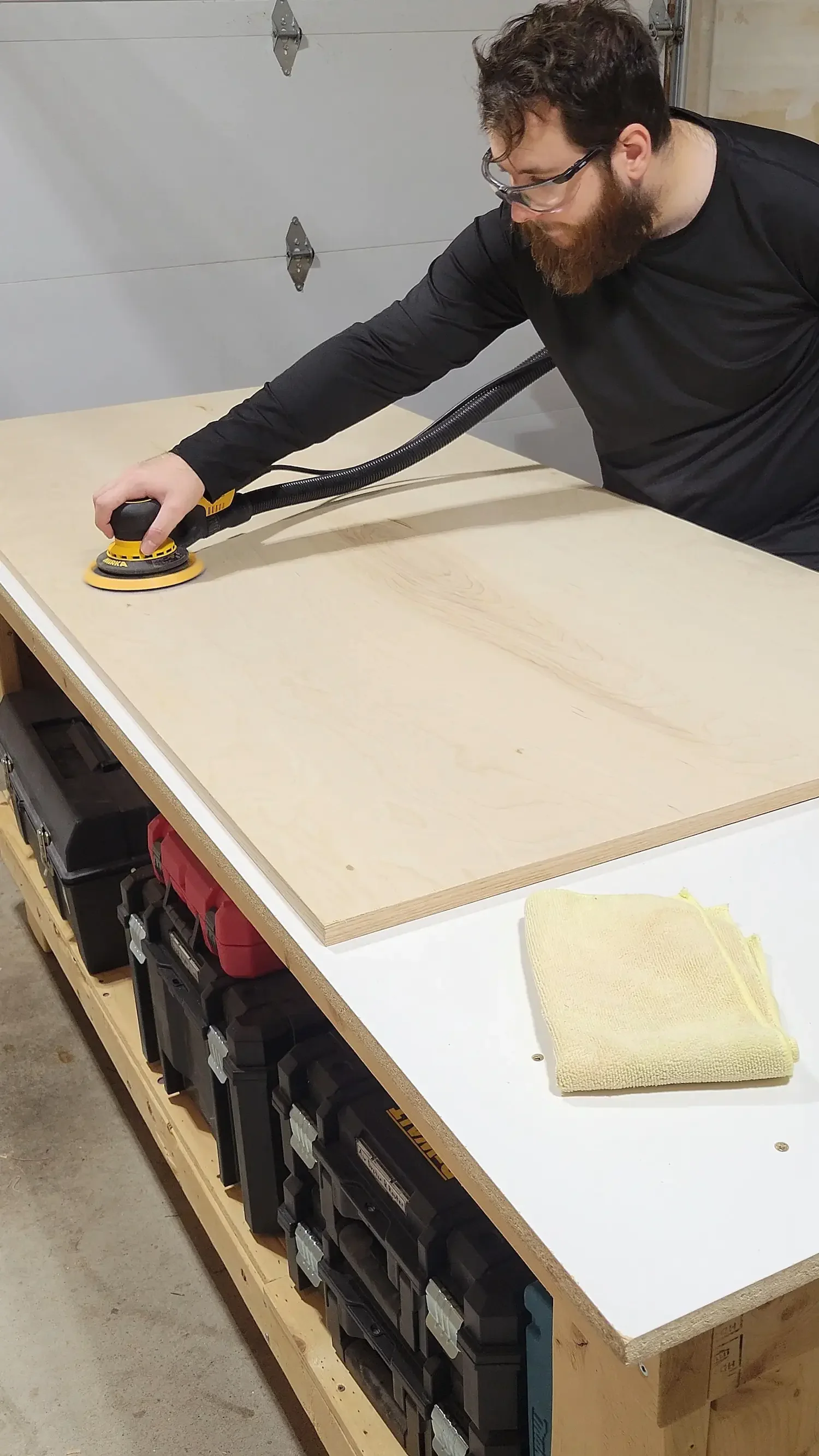sanding a table top made from plywood
