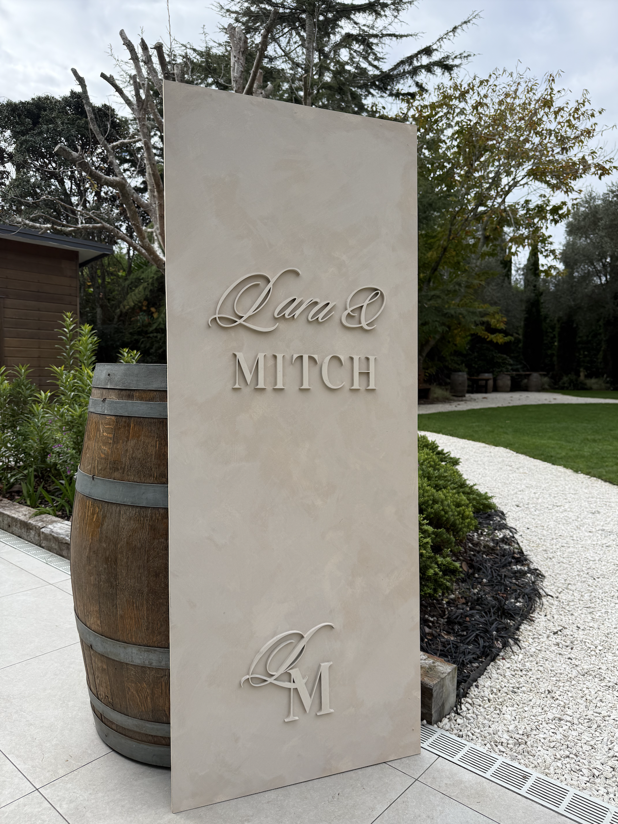Rendered looking venetain plaster stone welcome sign with custom monogram text