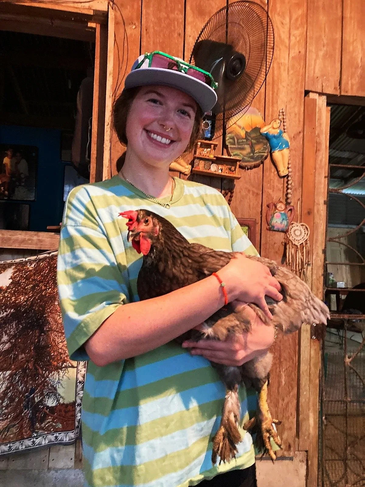 grace+holding+chicken+in+el+cocal+costa+rica.jpg