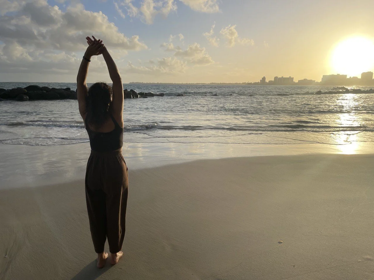 rachel stretching in the sunrise san juan puerto rico.jpg