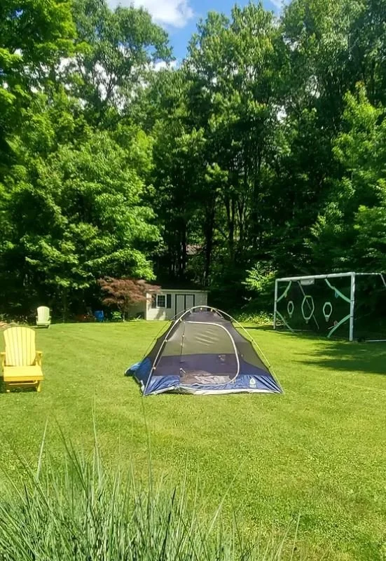 sleeping outside in my parents backyard in a tent.JPG